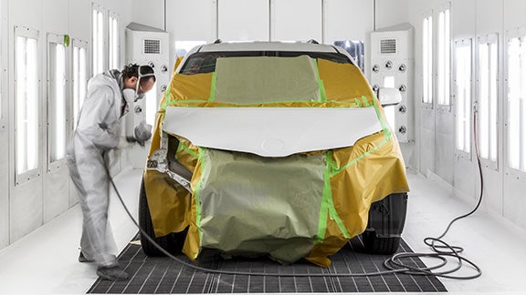 Collision Center Technician Painting a Vehicle | Sunrise Toyota in Oakdale NY